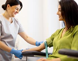 Phlebotomy Technician taking blood